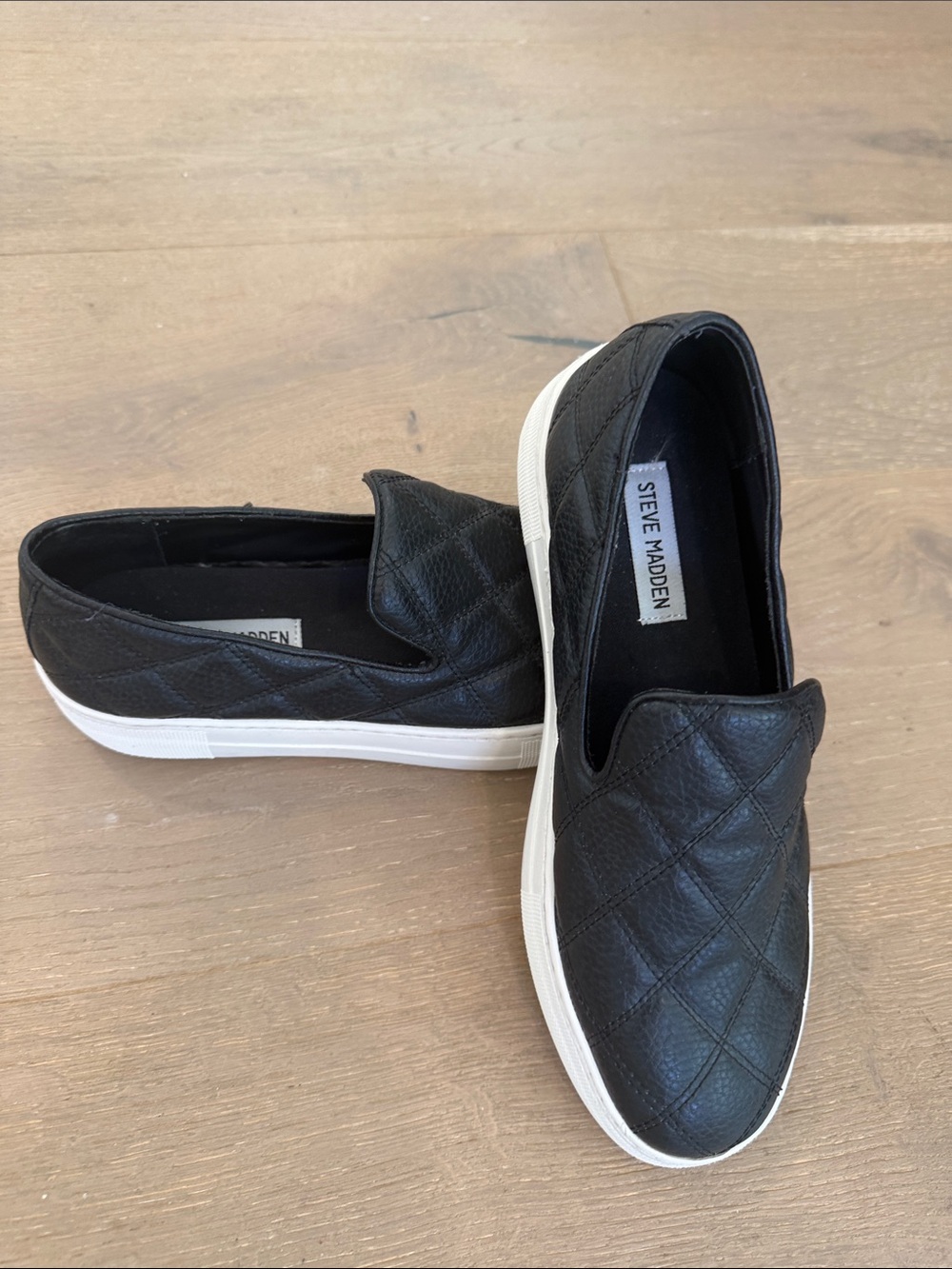Steve Madden Black Quilted Slip-On Sneakers with White Platform Sole